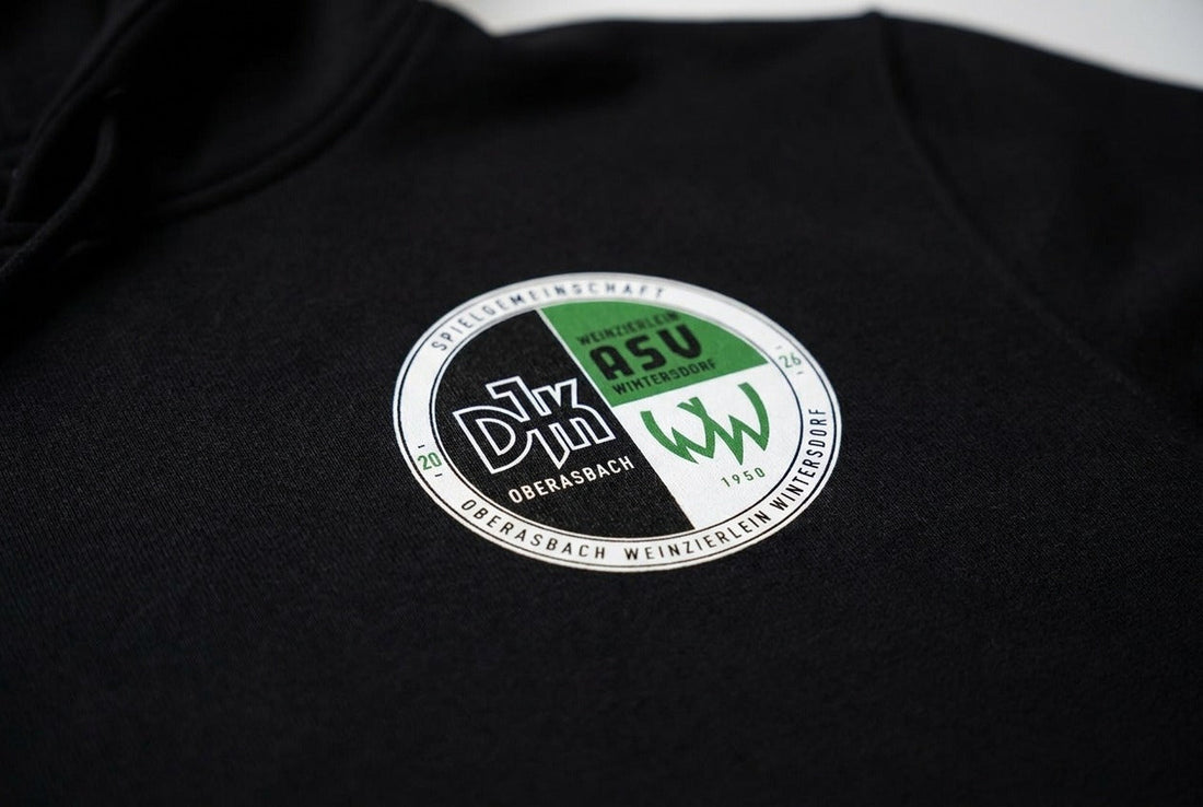 Schwarz, Weiß, Grün: Das Wappen der Spielgemeinschaft erklärt